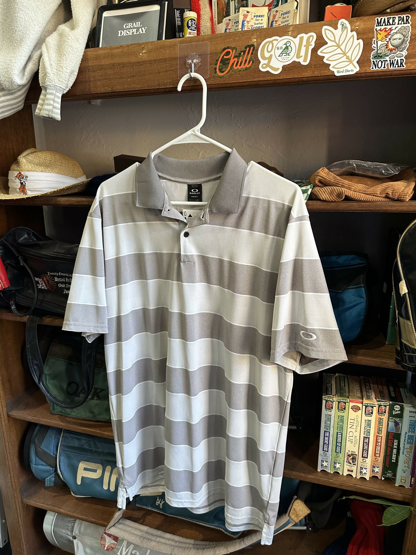 Grey and white Oakley polo